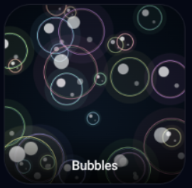 Glowing bubbles floating on a dark background.