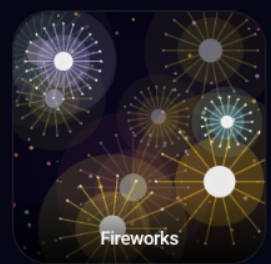 Gold and white fireworks bursting in a dark sky.